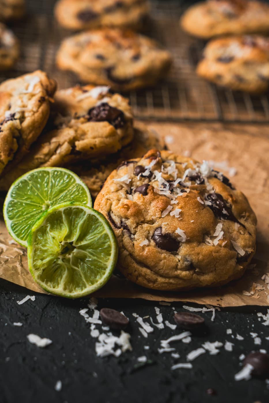 kelly-jean-TclQHtlkzRc-unsplash Coconut lime chocolate chip cookies laid out on a table garnished in toasted coconut