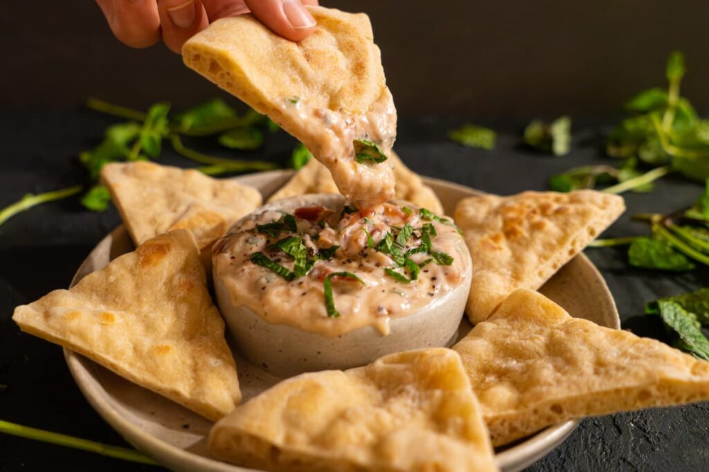 minted yogurt and jammy onion dip served with pita bread