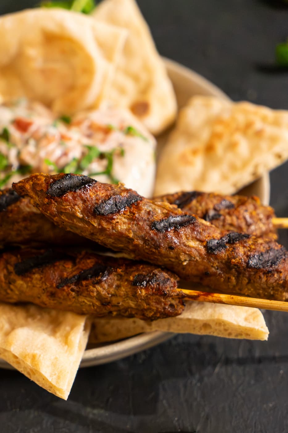 keriliwi-cnlniMp2ww4-unsplash Grilled Ground Beef Kebabs served alongside pita and yogurt sauce
